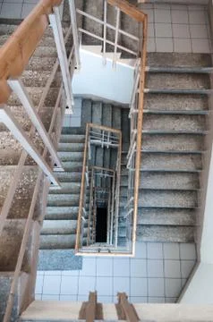 Rectangular concrete and steel staircase with wooden rails, top view, nobody Stock Photos