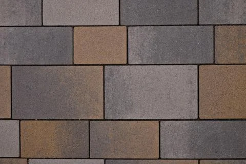 Rectangular floor tile gray and beige colors. Top view. Selective focus. 스톡 사진