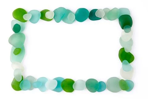 Rectangular frame laid out from blue and green glass sea pebbles and fragments Stock Photos
