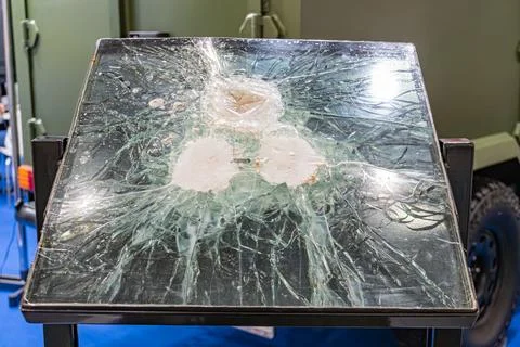 Rectangular glass object, shattered into jagged pieces like a sunburst, possi 스톡 사진
