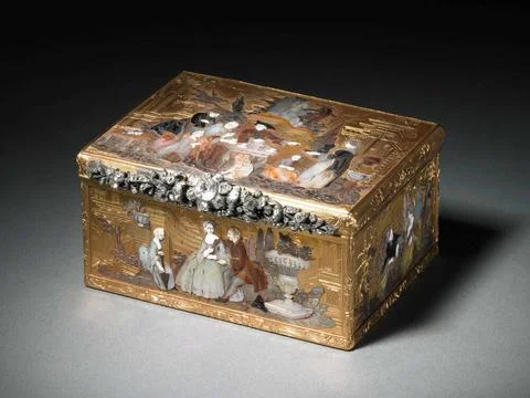 . Rectangular golden box topped with mosaic of mother-of-pearl, with which... Stock Photos