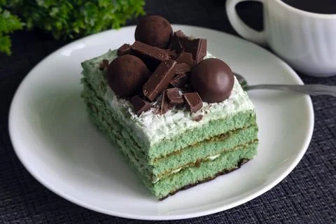 Rectangular green cake on a white plate Stock Photos