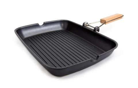 Rectangular grill pan with non-stick coating and wooden handle Stock Photos