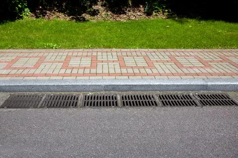 Rectangular hatches of the lattice of the drain system for drainage. Stock Photos