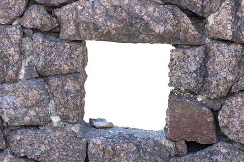 Rectangular hole in the wall made of natural stone Stock Photos