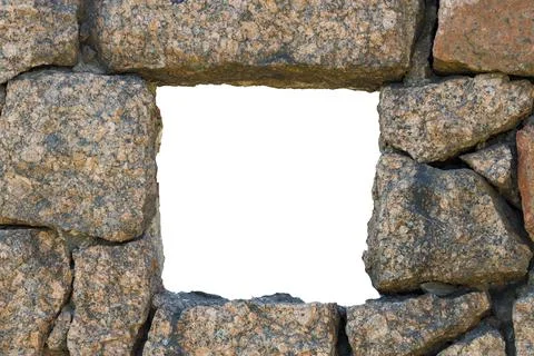 Rectangular hole in the wall made of natural stone Stock Photos