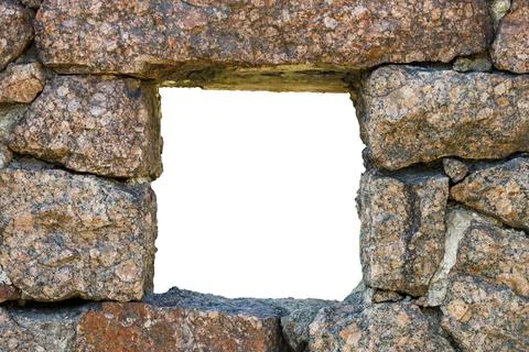 Rectangular hole in the wall made of natural stone Stock Photos
