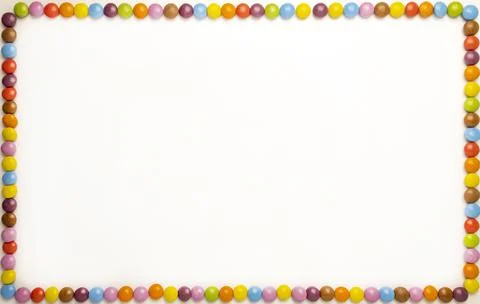 Rectangular horizontal photo frame on a white background with chocolates of Stock Photos