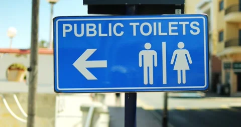 Rectangular information sign with male female images under Public Toilets text 스톡 동영상 317826342