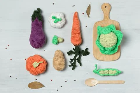 Rectangular layout with toy vegetables. Amigurumi toys, a set for the cook. Top Stock Photos