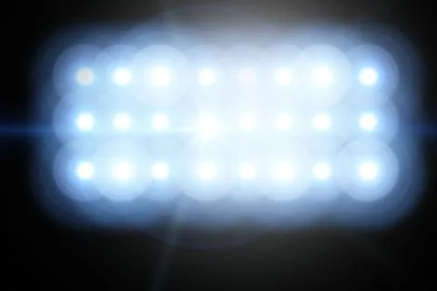 Rectangular LED panel is emitting intense glare and lens flare against dark 스톡 일러스트