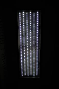 Rectangular LED panel light with neatly arranged bright white glowing dots Stock Photos
