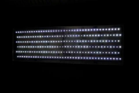 Rectangular LED panel light with neatly arranged bright white glowing dots Stock Photos