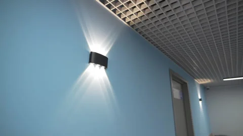 Rectangular lights project intricate rays onto wall Stock Footage 324907713