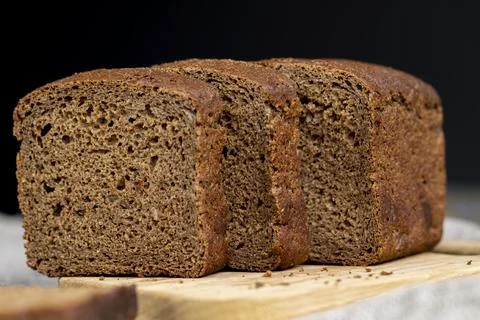Rectangular loaf of bread on a linen cloth 写真素材