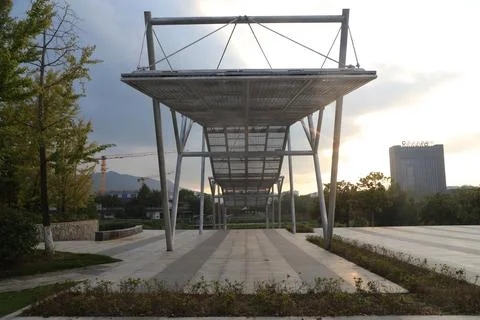 The rectangular metal structure stands on the concrete floor Stock Photos