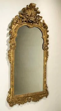 . Rectangular mirror in a list of gold-plated lion wood; The top is double... Stock Photos