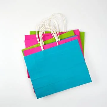 Rectangular multi-colored paper shopping bags with handles Stock Photos