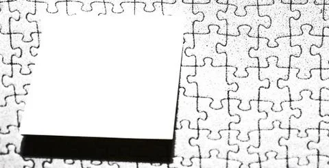 Rectangular note paper attached to puzzle shape background. A piece of square Stock Photos