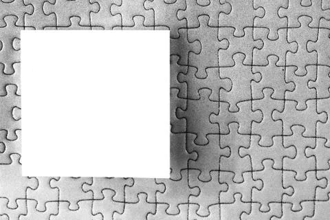 Rectangular note paper attached to puzzle shape background. A piece of square Stock Photos
