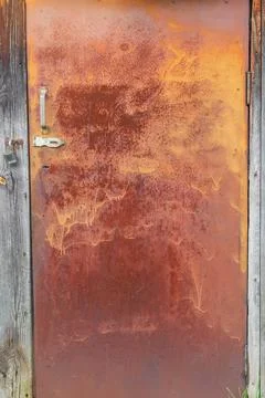 Rectangular old iron and rusty door to the village barn Foto stock