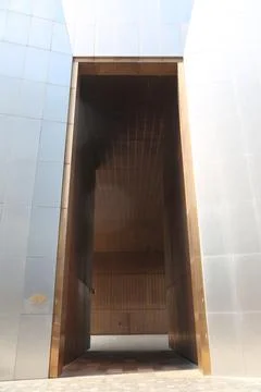 A rectangular opening in the wall of an industrial building made from shiny.. 스톡 사진