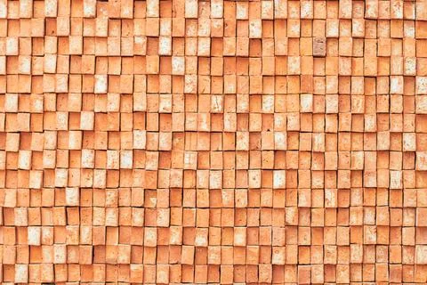 Rectangular orange bricks random pattern wall facade texture material in arch Stock Photos