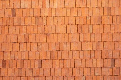 Rectangular orange bricks random pattern wall facade texture material in arch Stock Photos