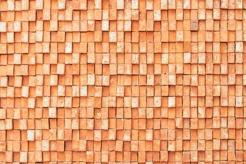 Rectangular orange bricks random pattern wall facade texture material in arch Stock Photos