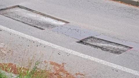 Rectangular Patch of Street Surface Asphalt Cut Away around Pothole Stock Footage 279388664