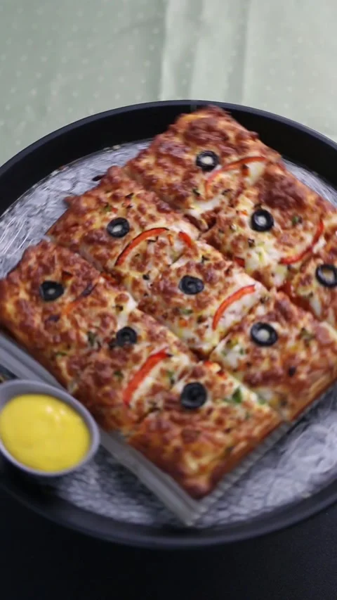 Rectangular pepperoni pizza with melted cheese and crispy crust 스톡 동영상 307058525