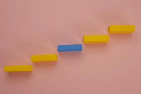 Rectangular pieces of wood in the shape of a ladder on a pink background Stock Photos
