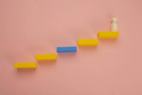 Rectangular pieces of wood in the shape of a ladder on a pink background Stock Photos