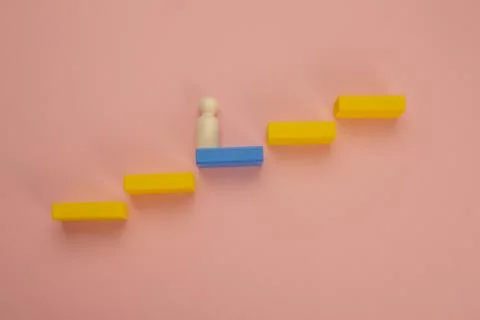 Rectangular pieces of wood in the shape of a ladder on a pink background Stock Photos