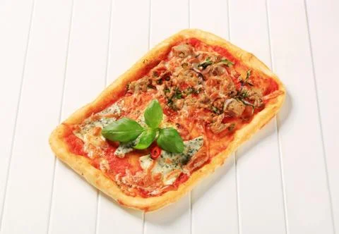 Rectangular pizza topped with blue cheese and tuna Stock Photos