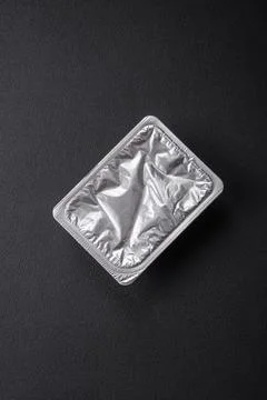 Rectangular plastic box with yogurt or cheese hermetically sealed with a fo.. Stock Photos