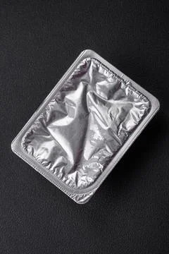 Rectangular plastic box with yogurt or cheese hermetically sealed with a fo.. Stock Photos