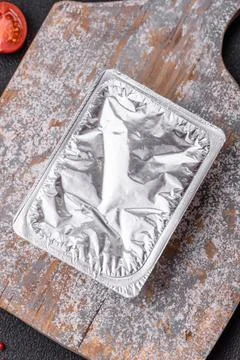 Rectangular plastic box with yogurt or cheese hermetically sealed with a fo.. Foto stock