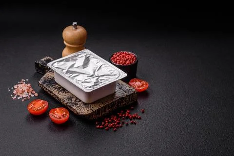 Rectangular plastic box with yogurt or cheese hermetically sealed with a fo.. Stock Photos