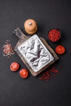 Rectangular plastic box with yogurt or cheese hermetically sealed with a fo.. Stockfoto's