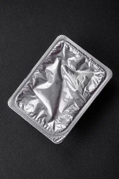 Rectangular plastic box with yogurt or cheese hermetically sealed with a f... Stockfoto's