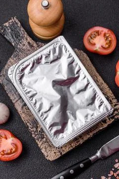 Rectangular plastic box with yogurt or cheese hermetically sealed with a fo.. Stock Photos