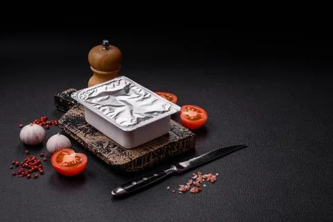 Rectangular plastic box with yogurt or cheese hermetically sealed with a fo.. Stock Photos