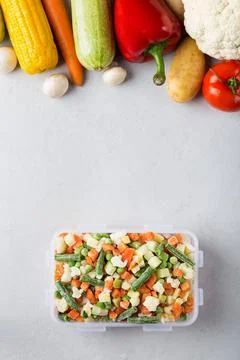 Rectangular plastic container with mix of frozen vegetables top view  Stock Photos