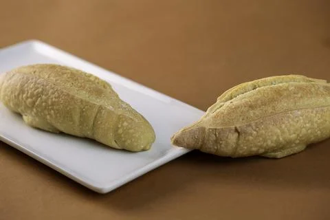 Rectangular plate with fresh buns 스톡 사진