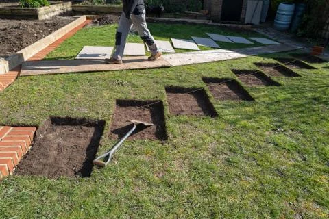 Rectangular sections cut into a lawn in preparation for concrete base and the Stock Photos
