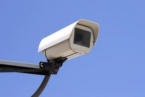Rectangular shape video surveillance camera on the street on blue sky 스톡 사진
