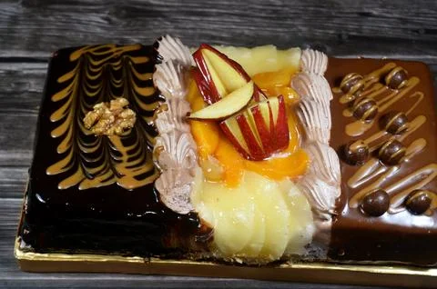 Rectangular shaped birthday cake of 3 parts of different pieces sponge crea.. Stock Photos