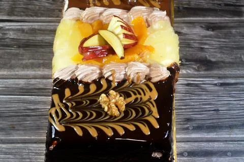 Rectangular shaped birthday cake of 3 parts of different pieces sponge crea.. Stock Photos