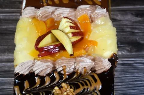 Rectangular shaped birthday cake of 3 parts of different pieces sponge crea.. Stock Photos